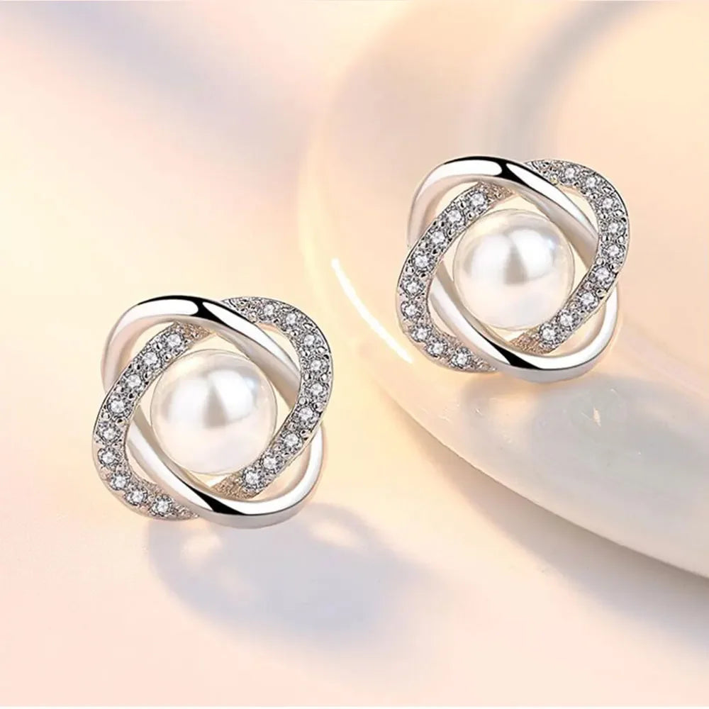 The Luxe Twist Zircon Pearl Stud Earrings in Sterling Silver